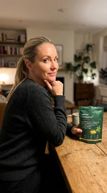 Woman holding Herbies Oregano+