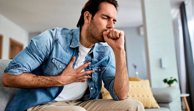 Man coughing and in distress